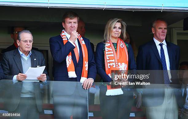 King Willem-Alexander of the Netherlands and Queen Maxima of the Netherlands look on during the 2014 FIFA World Cup Brazil Group B match between...