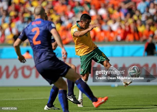 Tim Cahill of Australia shoots and scores his team's first goal during the 2014 FIFA World Cup Brazil Group B match between Australia and Netherlands...