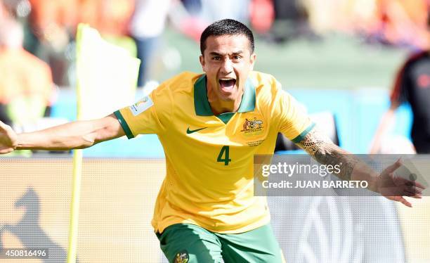Australia's forward Tim Cahill celebrates after scoring during a Group B football match between Australia and the Netherlands at the Beira-Rio...