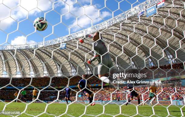 Tim Cahill of Australia scores the team's first goal past Jasper Cillessen of the Netherlands during the 2014 FIFA World Cup Brazil Group B match...