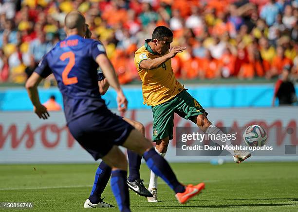 Tim Cahill of Australia shoots and scores his team's first goal during the 2014 FIFA World Cup Brazil Group B match between Australia and Netherlands...
