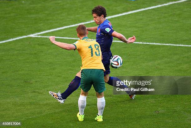 Oliver Bozanic of Australia shoots and hits the arm of Daryl Janmaat of the Netherlands during the 2014 FIFA World Cup Brazil Group B match between...