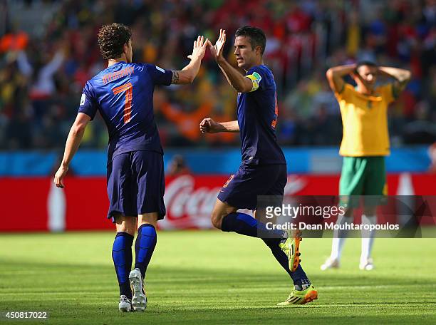 Robin van Persie of the Netherlands celebrates with Daryl Janmaat after scoring the second goal during the 2014 FIFA World Cup Brazil Group B match...