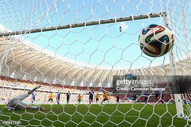 Mile Jedinak of Australia shoots and scores his team's second goal on a penalty kick past Jasper Cillessen of the Netherlands during the 2014 FIFA...