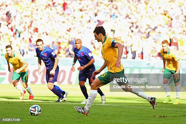 Mile Jedinak of Australia shoots and scores his team's second goal on a penalty kick past Jasper Cillessen of the Netherlands during the 2014 FIFA...