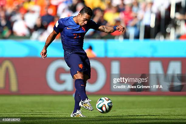 Memphis Depay of the Netherlands scores the team's third goal during the 2014 FIFA World Cup Brazil Group B match between Australia and Netherlands...