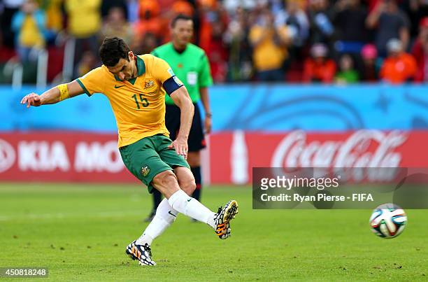 Mile Jedinak of Australia scores the team's second goal from the penalty spot during the 2014 FIFA World Cup Brazil Group B match between Australia...