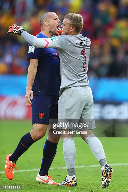 Ron Vlaar and Jasper Cillessen of the Netherlands celebrate after defeating Australia 3-2 during the 2014 FIFA World Cup Brazil Group B match between...