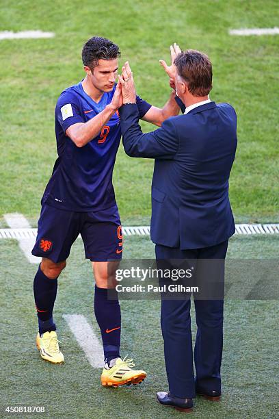 Robin van Persie of the Netherlands reacts with head coach Louis van Gaal as he exits the game during the 2014 FIFA World Cup Brazil Group B match...