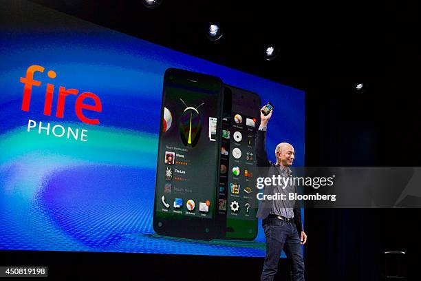 Jeff Bezos, chief executive officer of Amazon.com Inc., unveils the Fire Phone during an event at Fremont Studios in Seattle, Washington, U.S., on...