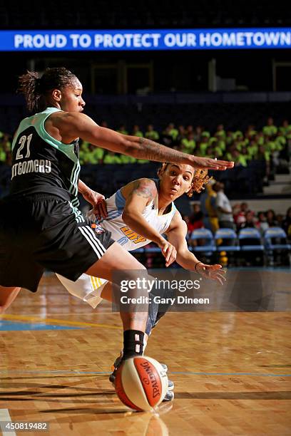 Courtney Clements of the Chicago Sky passes the ball past Alex Montgomery of the New York Liberty during the game on May 18, 2014 at Allstate Arena...