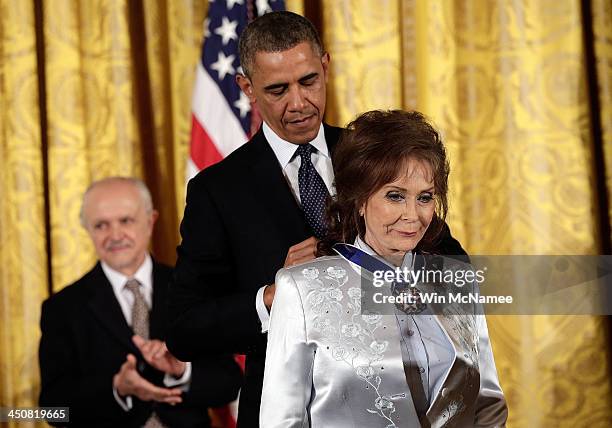 President Barack Obama awards the Presidential Medal of Freedom to Loretta Lynn in the East Room at the White House on November 20, 2013 in...