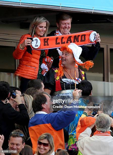 Queen Maxima of the Netherlands and King Willem-Alexander of the Netherlands celebrate their team's victory with fans after the 2014 FIFA World Cup...