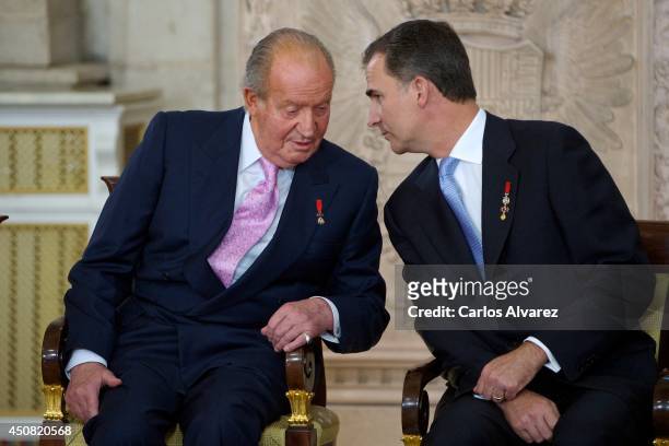 Prince Felipe of Spain and King Juan Carlos of Spain attend the official abdication ceremony at the Royal Palace on June 18, 2014 in Madrid, Spain.