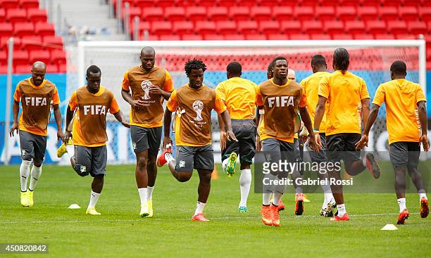 Players of Cote D'Ivoire warm up during the training session ahead of the Group C match between Colombia and Cote D'Ivoire as part of FIFA World Cup...