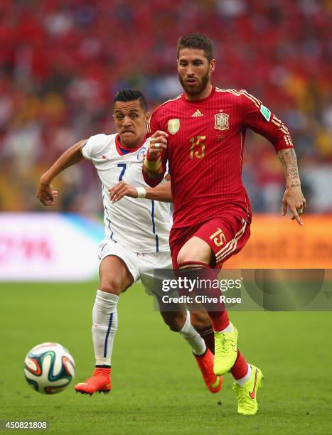 Sergio Ramos of Spain controls the ball against Alexis Sanchez of Chile during the 2014 FIFA World Cup Brazil Group B match between Spain and Chile...