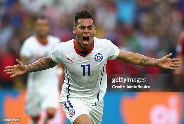 Eduardo Vargas of Chile celebrates scoring his team's first goal during the 2014 FIFA World Cup Brazil Group B match between Spain and Chile at...