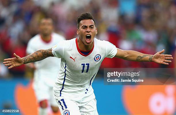 Eduardo Vargas of Chile celebrates scoring his team's first goal during the 2014 FIFA World Cup Brazil Group B match between Spain and Chile at...