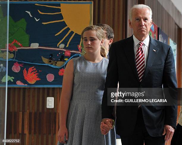Vice-President Joe Biden visits with his granddaughter Maisy the Center for Memory and Reconciliation in Bogota, a museum about the victims of the...