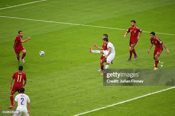 Charles Aranguiz of Chile shoots and scores his team's second goal during the 2014 FIFA World Cup Brazil Group B match between Spain and Chile at...