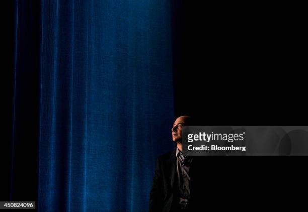 Jeff Bezos, chief executive officer of Amazon.com Inc., watches a demonstration of the Fire Phone during an event at Fremont Studios in Seattle,...