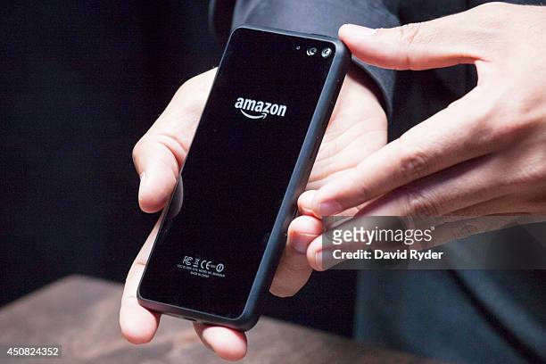 The back of Amazon.com's first smartphone, the Fire Phone, is displayed during a demonstration at the company's Fire Phone launch event on June 18,...