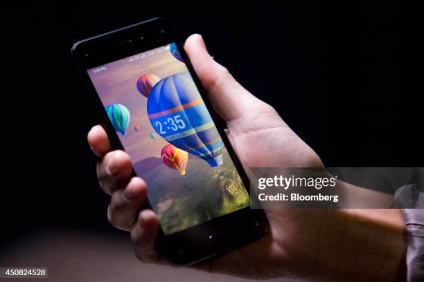 The Amazon.com Inc. Fire Phone is displayed for a photograph during an event at Fremont Studios in Seattle, Washington, U.S., on Wednesday, June 18,...