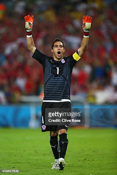 Claudio Bravo of Chile celebrates after defeating Spain 2-0 during the 2014 FIFA World Cup Brazil Group B match between Spain and Chile at Maracana...