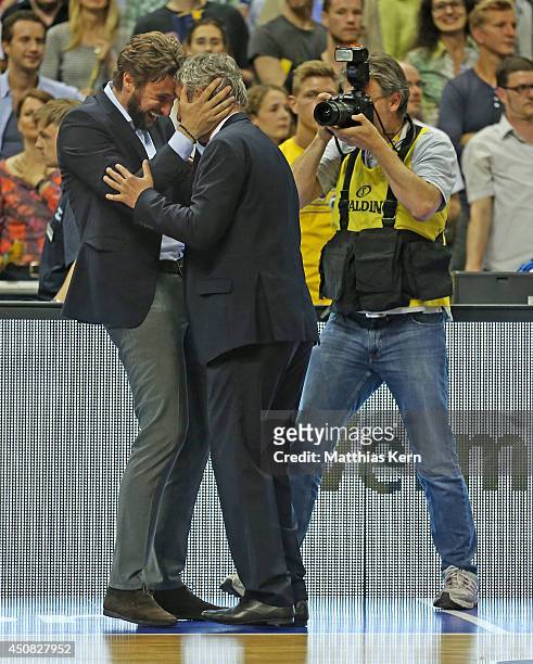 Head coach Svetislav Pesic of Muenchen and his son Marko show their delight after winning the Beko BBL playoff final game 4 between Alba Berlin and...