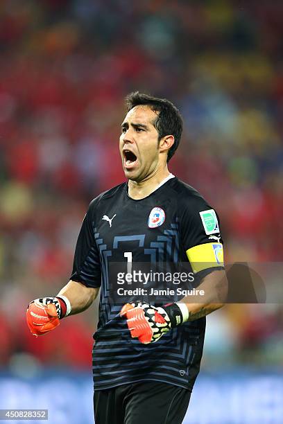 Claudio Bravo of Chile celebrates a 2-0 victory over Spain in the 2014 FIFA World Cup Brazil Group B match between Spain and Chile at Maracana on...