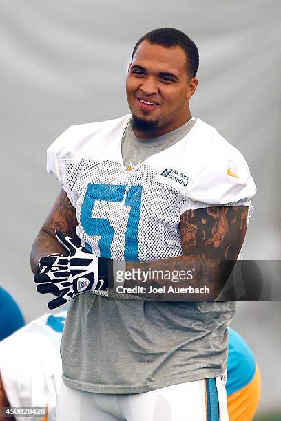 Mike Pouncey of the Miami Dolphins participates in drills during the minicamp on June 18, 2014 at the Miami Dolphins training facility in Davie,...