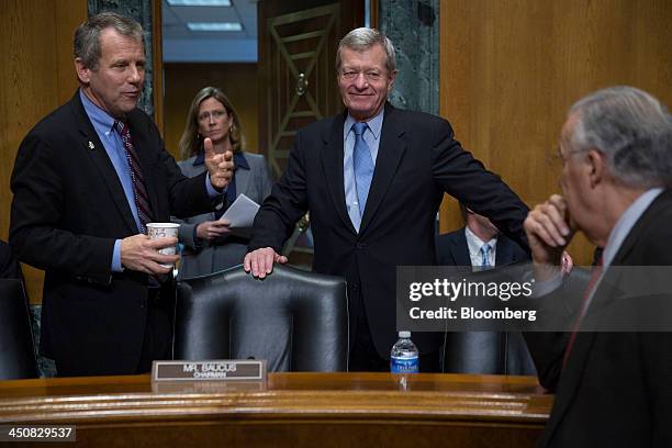 Senator Max Baucus, a Democrat from Montana and chairman of the Senate Finance Committee, center, and Senator Sherrod Brown, a Democrat from Ohio,...