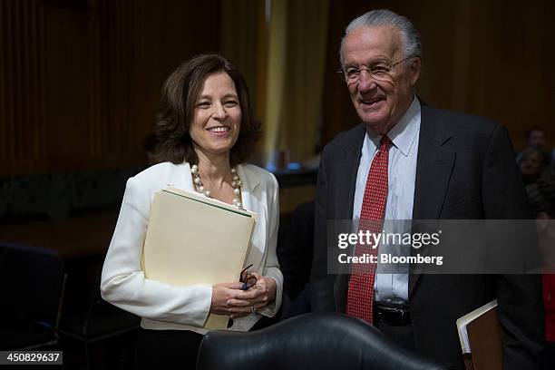 Sarah Bloom Raskin, governor of the U.S. Federal Reserve and nominee to be deputy U.S. Treasury secretary, left, talks to former Senator Paul...