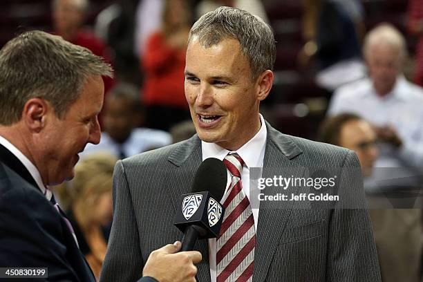 First year head coach Andy Enfield of the USC Trojans smiles as he is interviewed by Jim Watson on the Pac-12 Network after getting his first win at...