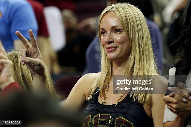 Model Amanda Enfield smiles as she makes a "V for victory" hand gesture after the home opening game between the Cal State Northridge Matadors and the...
