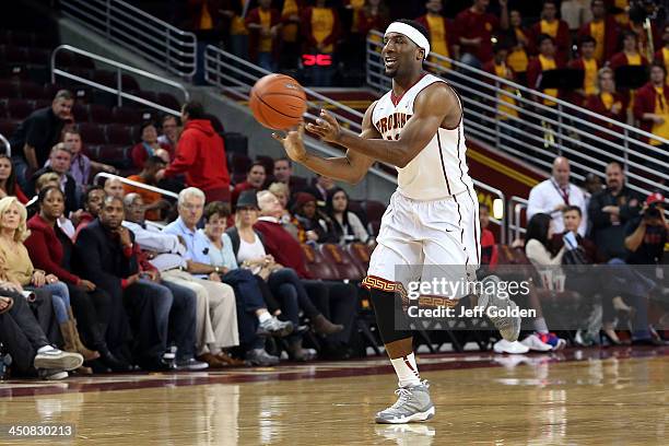 Pe'Shon Howard of the USC Trojans passes the ball against the Cal State Northridge Matadors in the second half of the home opening game at the Galen...