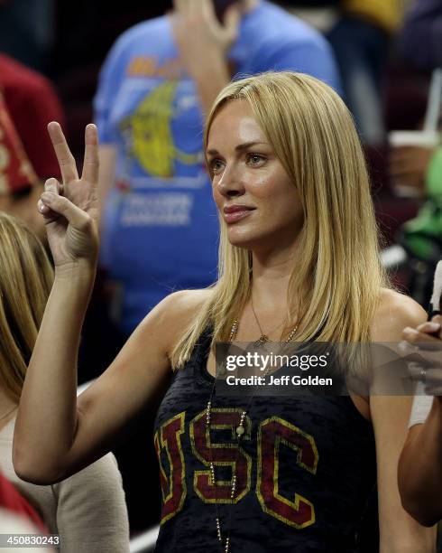 Model Amanda Enfield makes a "V for victory" hand gesture after the home opening game between the Cal State Northridge Matadors and the USC Trojans...