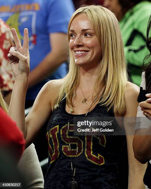 Model Amanda Enfield smiles as she makes a "V for victory" hand gesture after the home opening game between the Cal State Northridge Matadors and the...