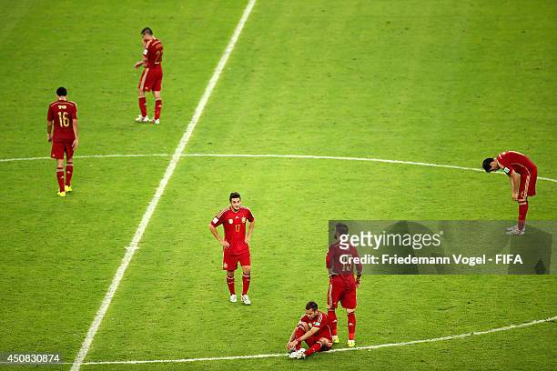 Players of Spain show their dejection afterthe 2014 FIFA World Cup Brazil Group B match between Spain and Chile at Estadio Maracana on June 18, 2014...