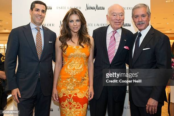 Jim Gold, Elizabeth Hurley, Leonard Lauder and Malcolm Reuben pose for a photograph during the Estee Lauder shop and compact museum opening at Neiman...