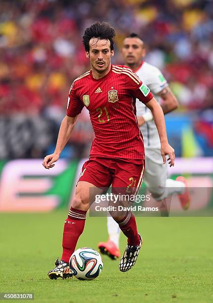 David Silva of Spain controls the ball during the 2014 FIFA World Cup Brazil Group B match between Spain and Chile at Maracana on June 18, 2014 in...