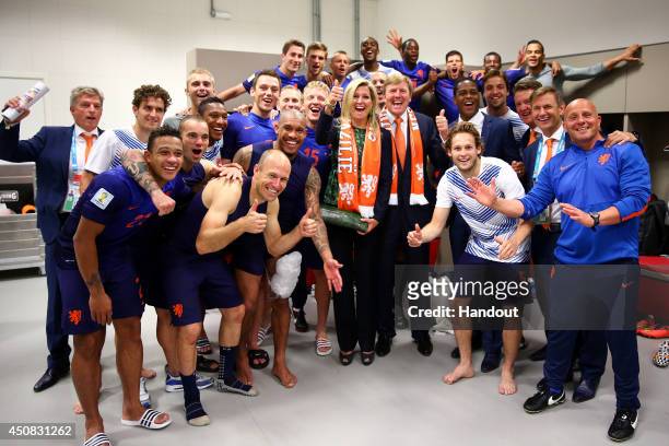 In this handout image supplied by the FIFA, King Willem-Alexander of the Netherlands and Queen Maxima of the Netherlands celebrate with the...
