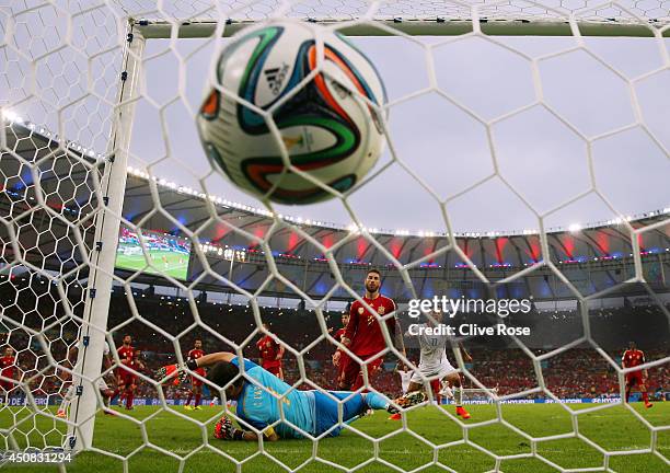 Charles Aranguiz of Chile scores the second goal past Iker Casillas of Spain during the 2014 FIFA World Cup Brazil Group B match between Spain and...