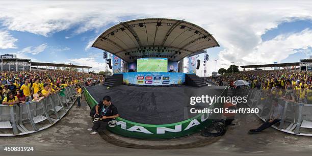 Fans of the Brazilian football team watch the Brazil v Mexico Group A match on a giant screen in the Fan Fest area in Porta Negro on June 17, 2014 in...