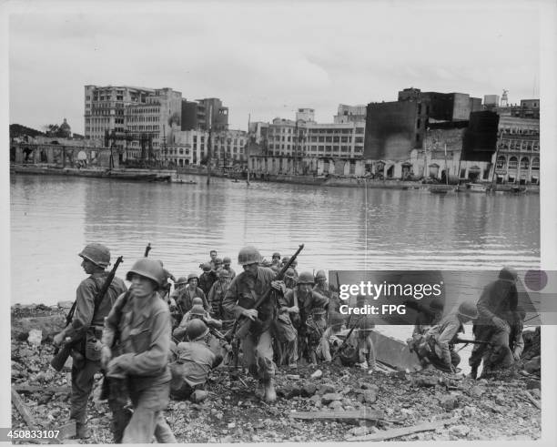 Troops preparing to launch an amphibious attack on the walled city of Manila during World War Two, Philippines, February 26th 1945.