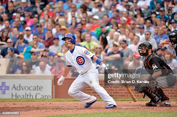 Darwin Barney of the Chicago Cubs doubles during the sixth inning against the Miami Marlins at Wrigley Field June 7, 2014 in Chicago, Illinois. The...