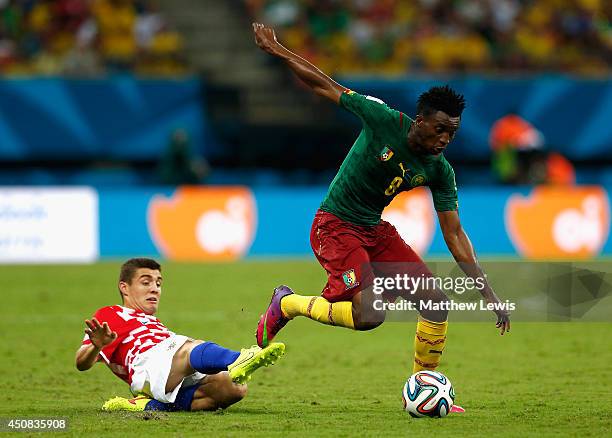 Benjamin Moukandjo of Cameroon controls the ball against Mateo Kovacic of Croatia during the 2014 FIFA World Cup Brazil Group A match between...