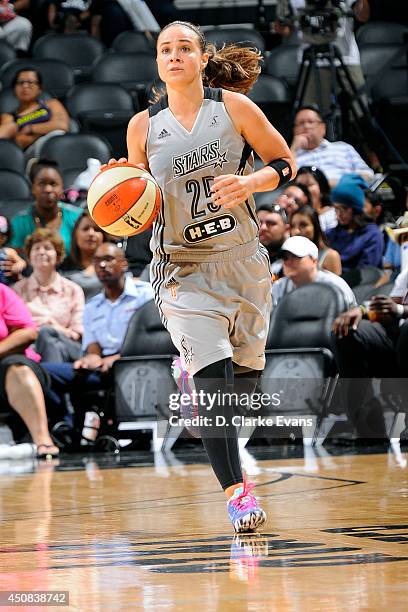 Becky Hammon of the San Antonio Stars drives against the Seattle Storm at AT&T Center on June 13, 2014 in San Antonio, Texas. NOTE TO USER: User...