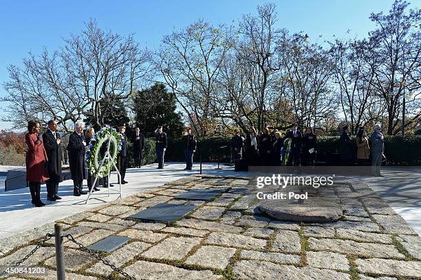 First lady Michelle Obama, U.S. President Barack Obama, Former U.S. President Bill Clinton and former U.S. Secretary of State Hillary Clinton lay a...