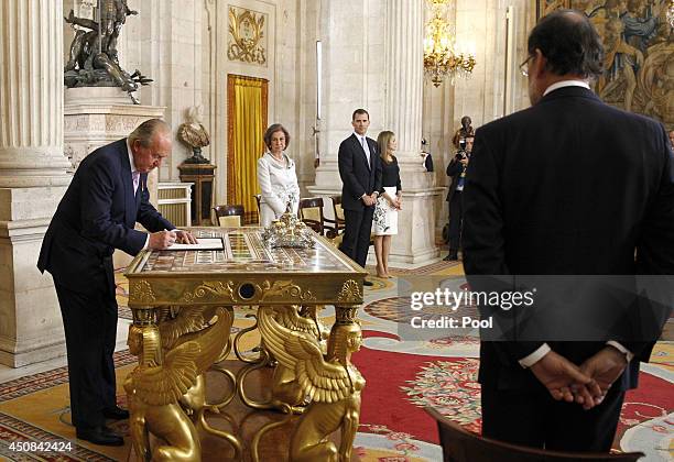 King Juan Carlos of Spain, in the presence of Queen Sofia of Spain, Prince Felipe of Spain, Princess Letizia of Spain and Prime Minister of Spain...